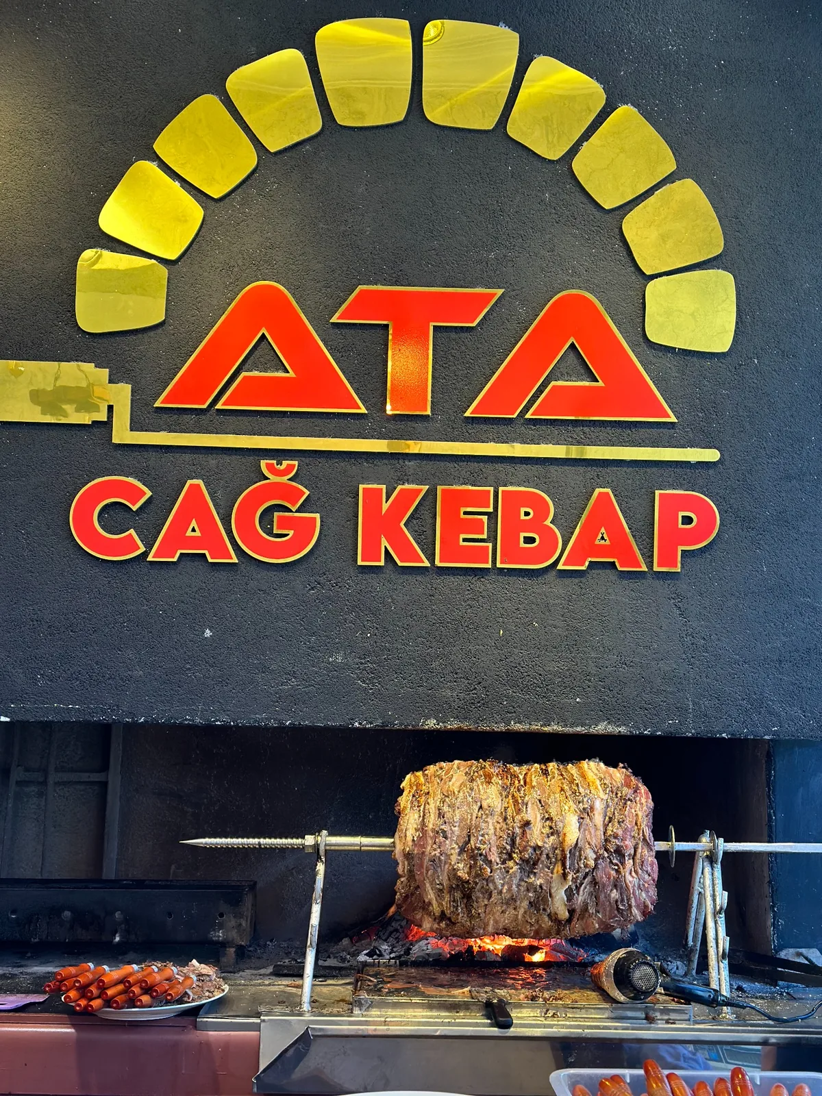 Ata Cağ Kebap ocağı ve logosu